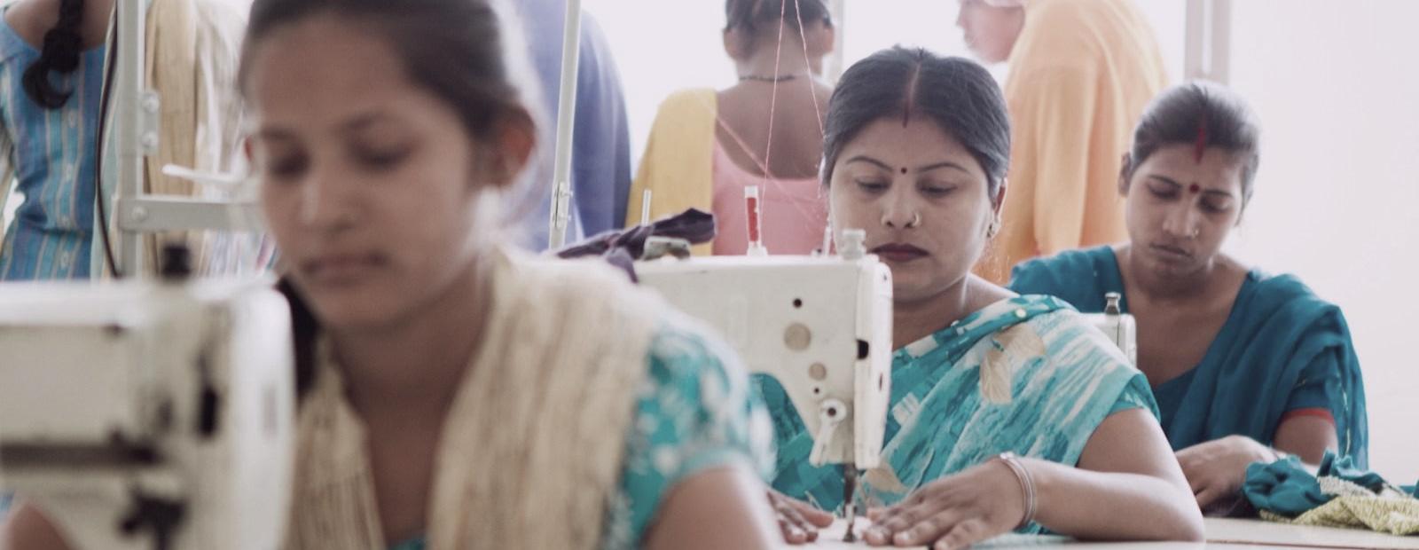 Women working at sewing machines in a garment unit